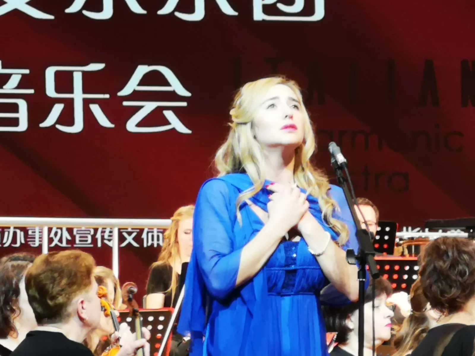 Venicia Rasmussen in concert in China, blue gown