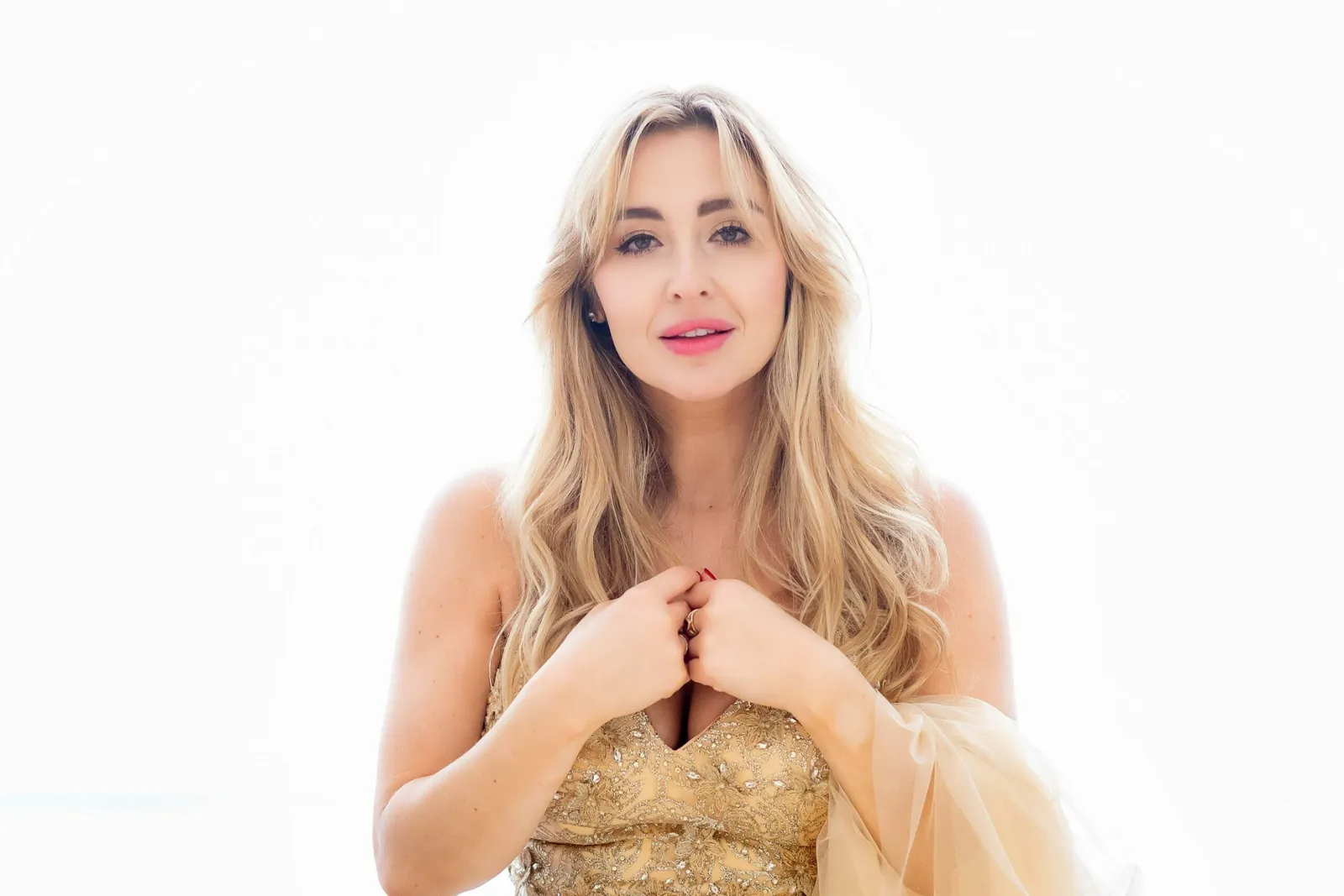 Venicia Rasmussen in gold dress, studio portrait